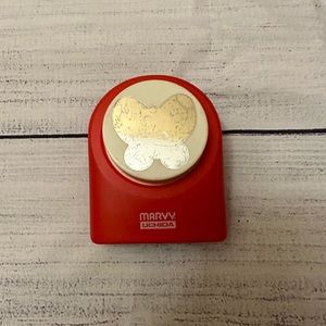 Butterfly hole punch